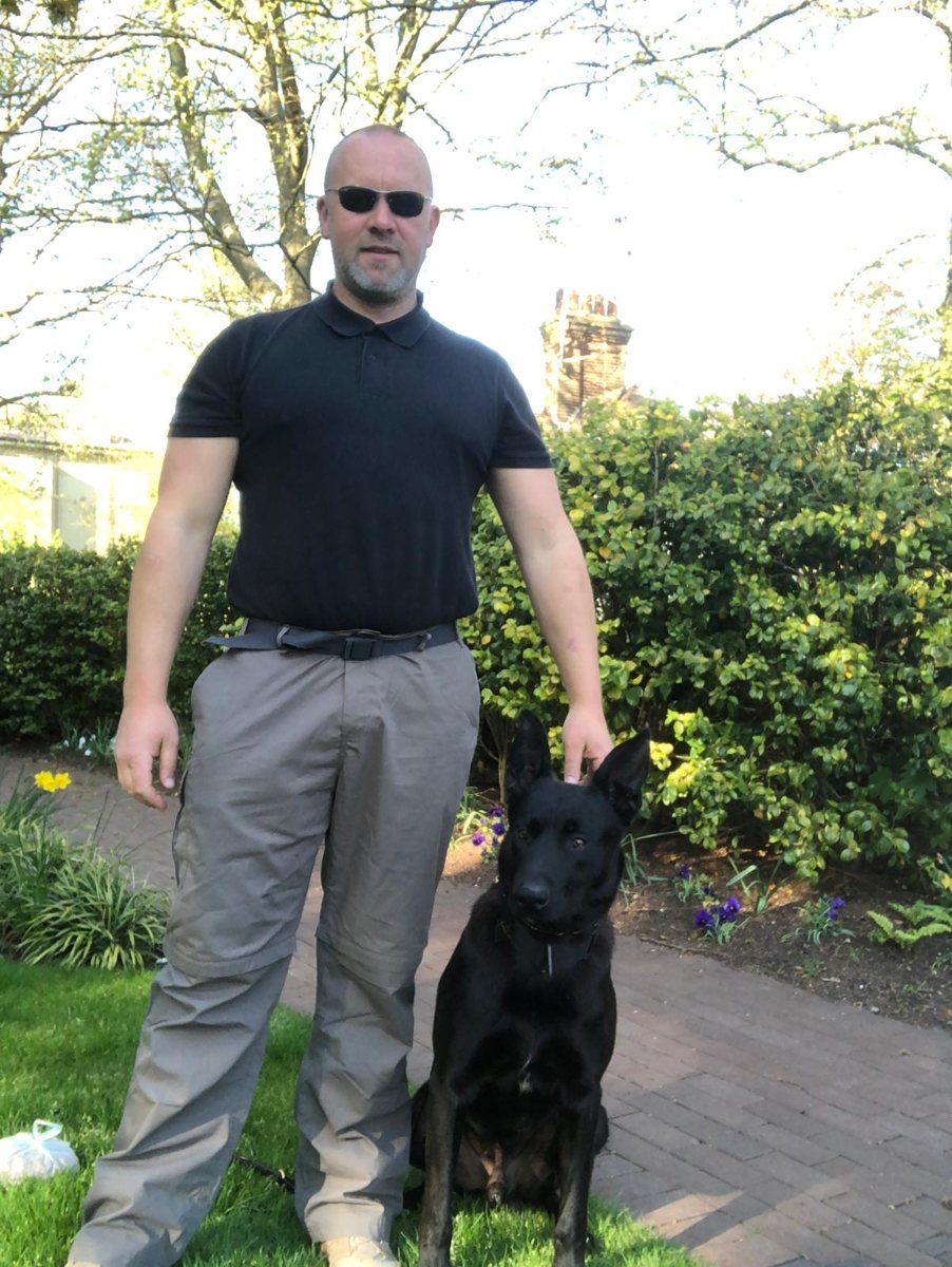 Tudor, founder of Celtic K9 Services, with a German Shepherd